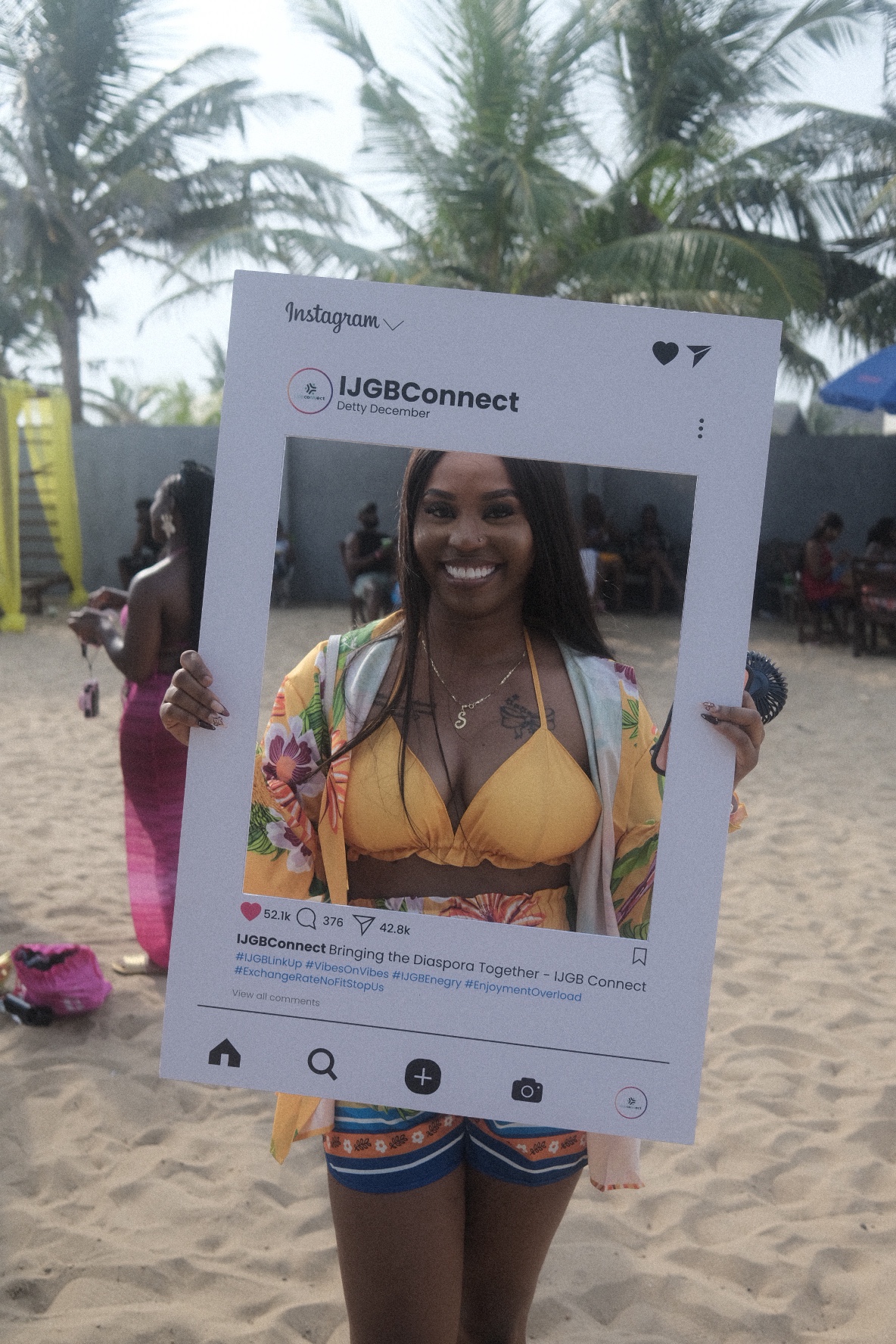 IJGB Connect Detty December — guest smiling with the IJGBConnect Instagram frame on the beach