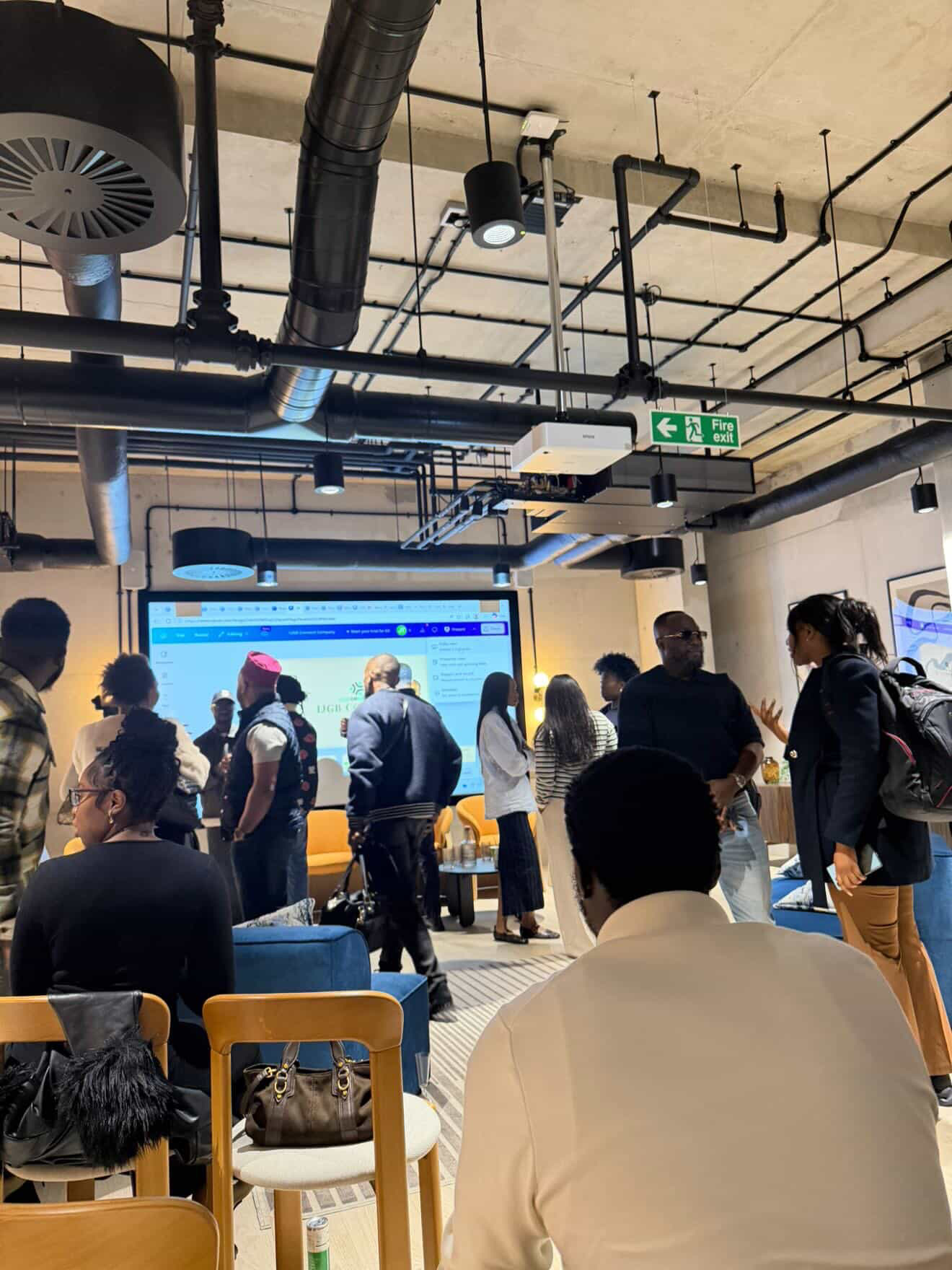 IJGB Connect London launch — community members watching the presentation at a co-working space