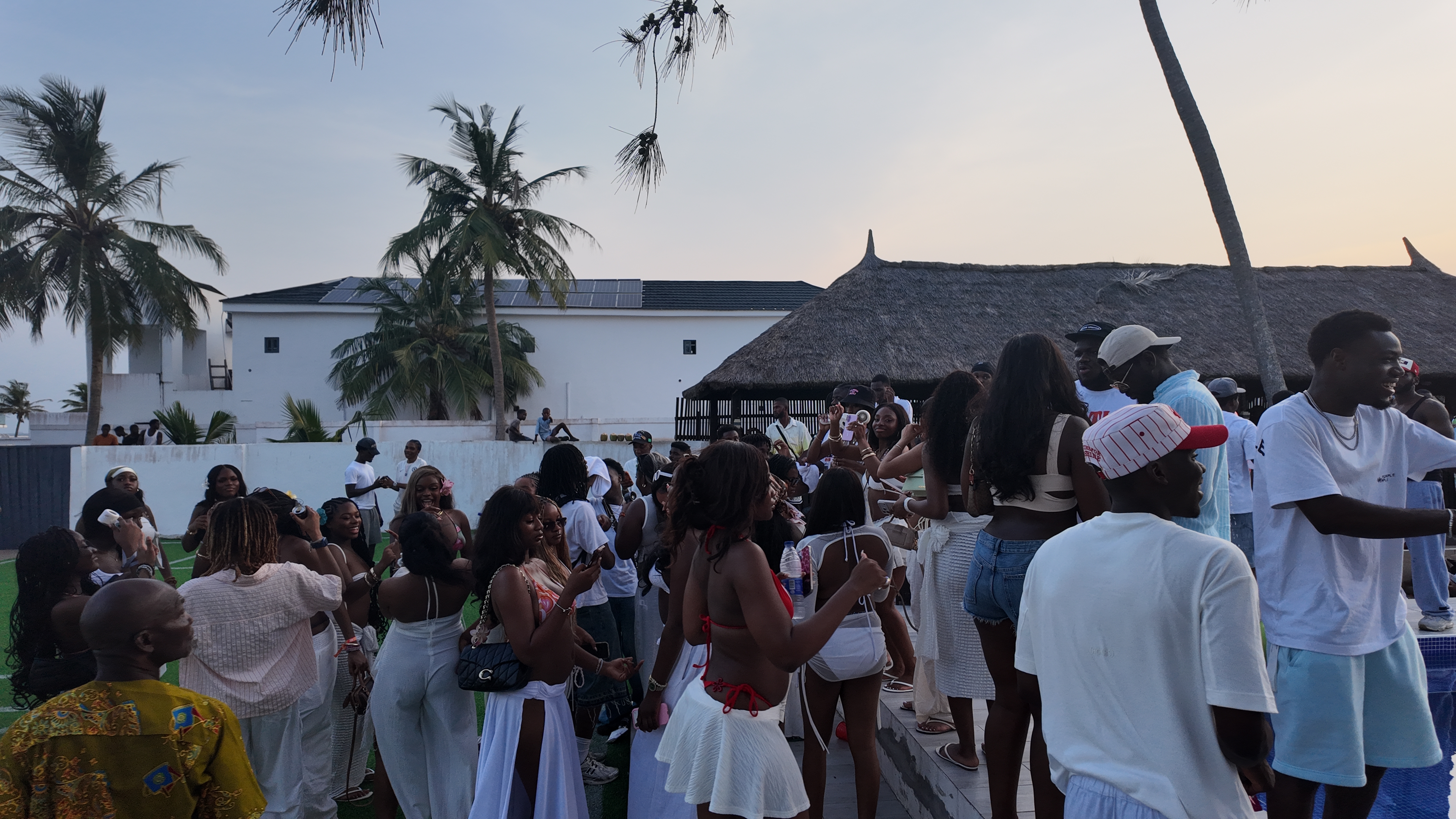 IJGB Connect white party — large crowd gathered on the lawn at sunset in Lagos