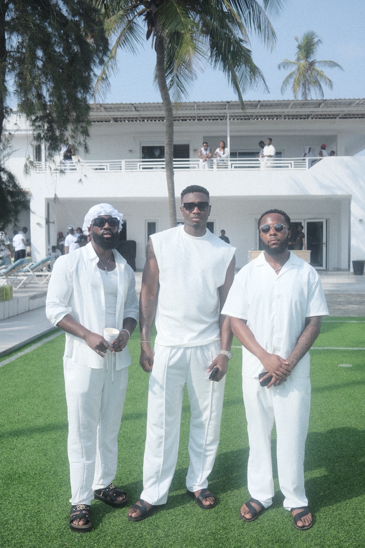 IJGB Connect white party — three friends in all-white at the Lagos pool party